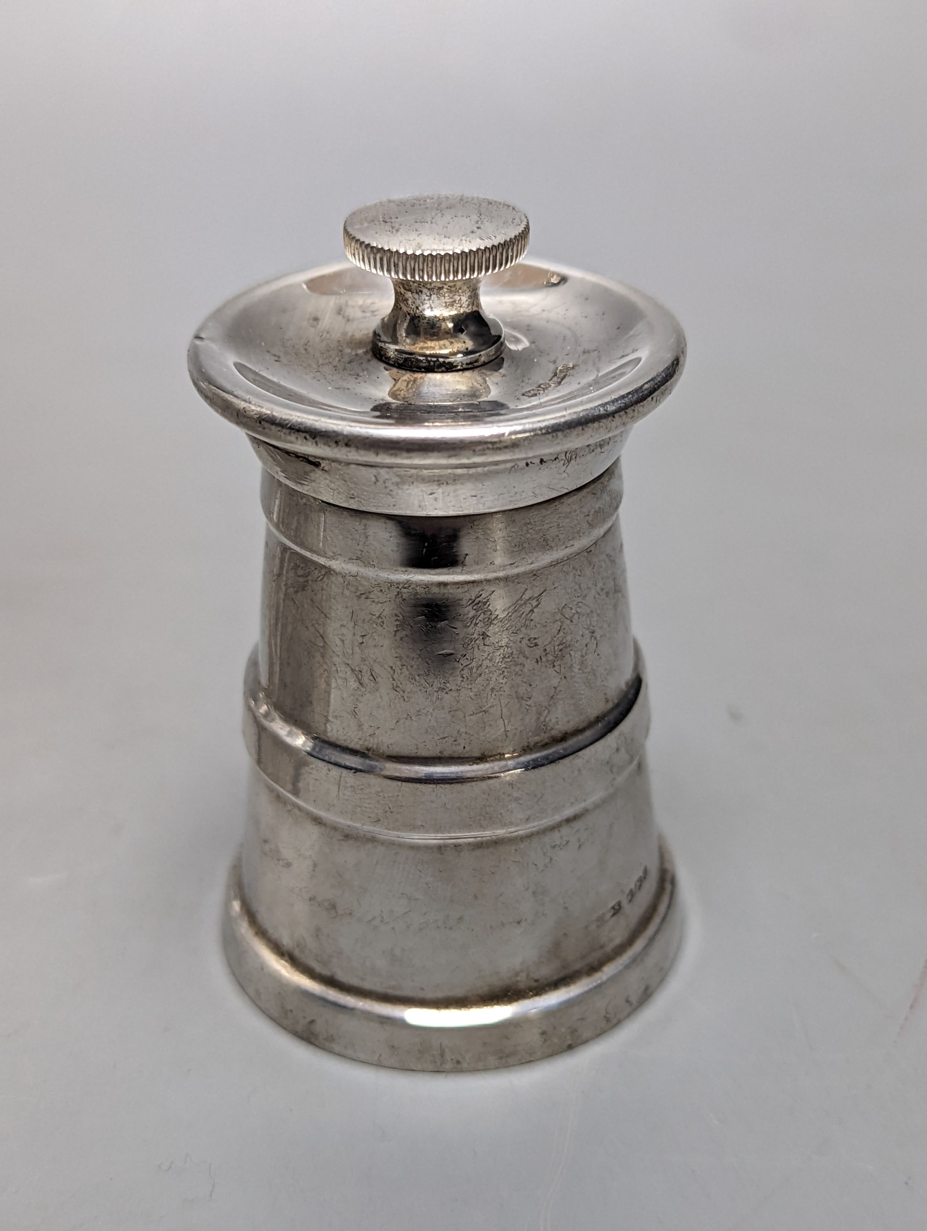 An Edwardian silver mounted cut glass decanter, Sheffield, 1903, 36cm and silver mounted pepper mill.